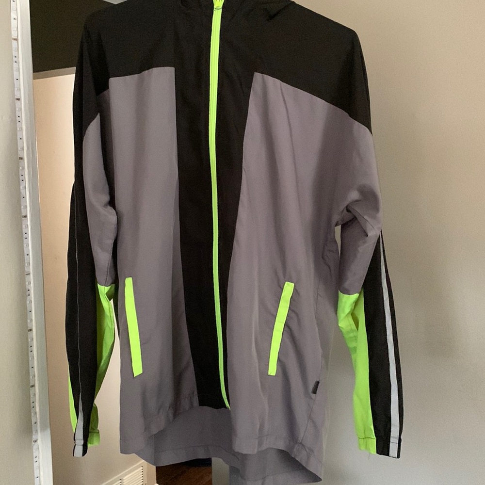 Mens, windbreaker,gently worn, non noticeable ink stain on inside right pocket.